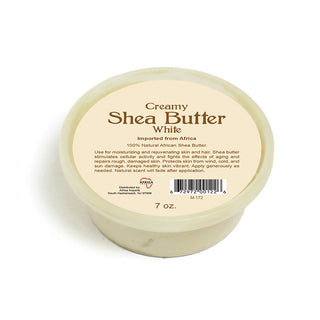 Jar of creamy shea butter with a label on a white background