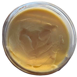 Close-up of a jar of light-colored cream or paste