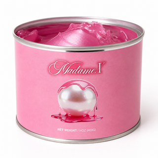 A pink cylindrical tin of Madame 1 pearl wax, showing the glossy pink wax inside and a graphic of a dripping pearl on the label, set against a plain white background.